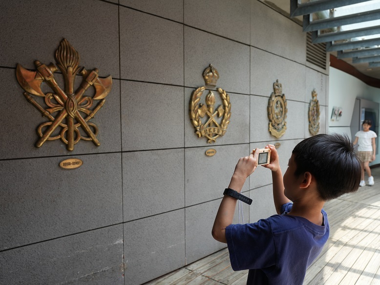 Visitors capture photographs of the marine heritage exhibits.
