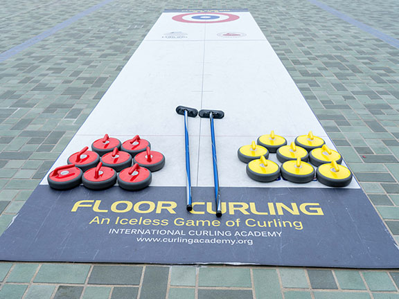 Floor curling is an emeriging sports that requires strategy and team cooperation