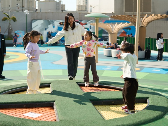 Yin Yin and her mother enjoy quality time together, playing happily in the trampoline area.