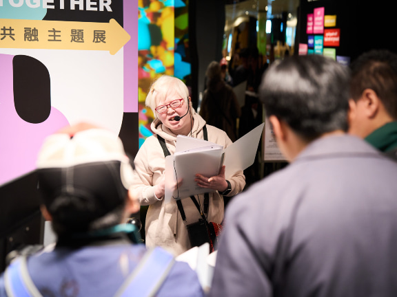 Carol, the visually impaired instructor, teaches principles of inclusion.