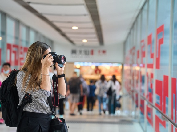 Emily takes photographs inside a Link mall.