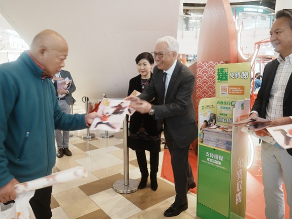 A resident collects a free copy of CHOICE Magazine at Temple Mall.