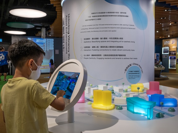 VR technology allows visitors to experience how Link builds self-sufficient community hubs through asset enhancement.