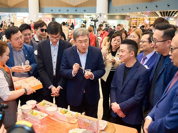 Deputy Chief Secretary for Administration Mr Cheuk Wing-hing samples the soft meals.