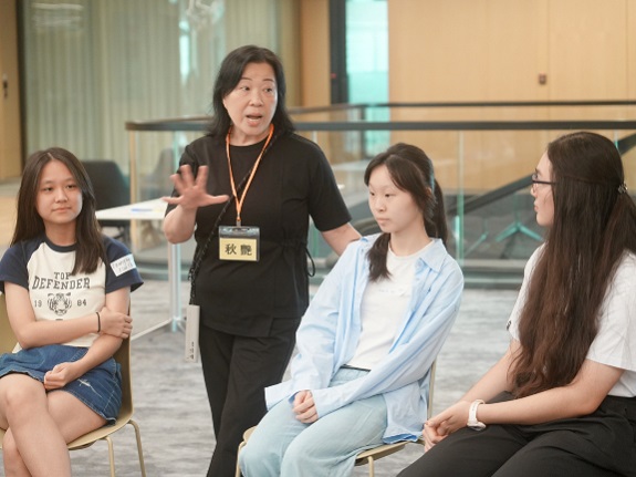 Chau Yim emphasises to students the value of listening attentively to the perspectives of others.