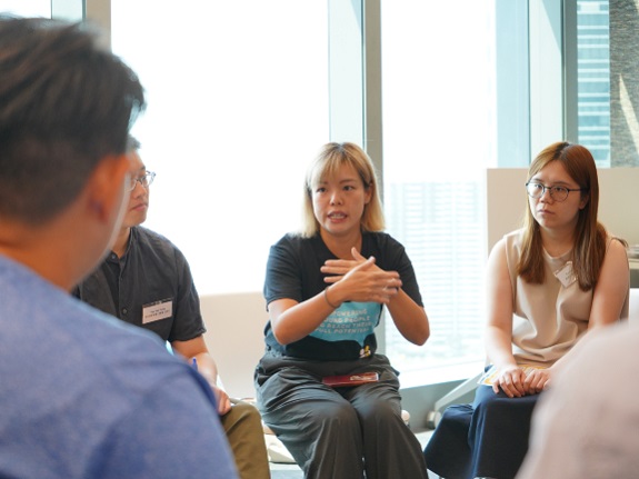 Cindy Ng (centre) points out that KELY’s initiative seeks to incorporate emotion management courses into the curriculum, allowing teachers and students to learn essential techniques.