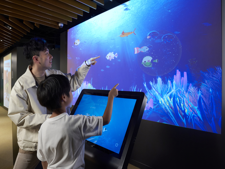 Visitors can turn themselves into a unique, self-designed fish for a swim in the interactive game.
