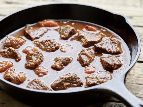 Braised Pork Fillet with Onions and Tomatoes Recipe as a Sweet and Sour Appetizer