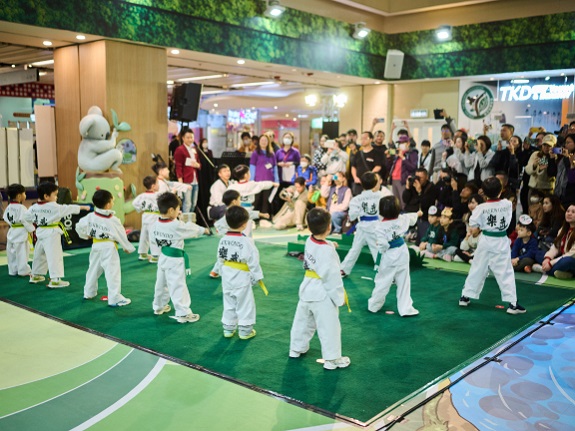 Young Taekwondo students deliver an exciting performance for residents. 