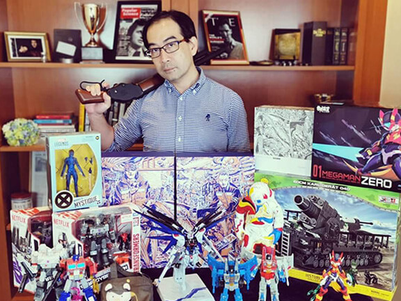 Douglas Mok showing his toys