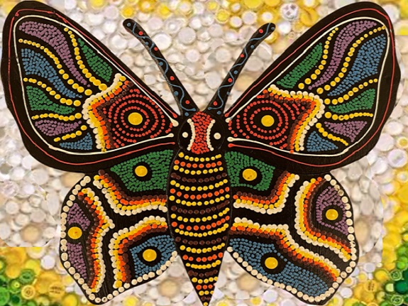 Dora’s design uses recycled plastic bottle caps to create a vibrant butterfly artwork.