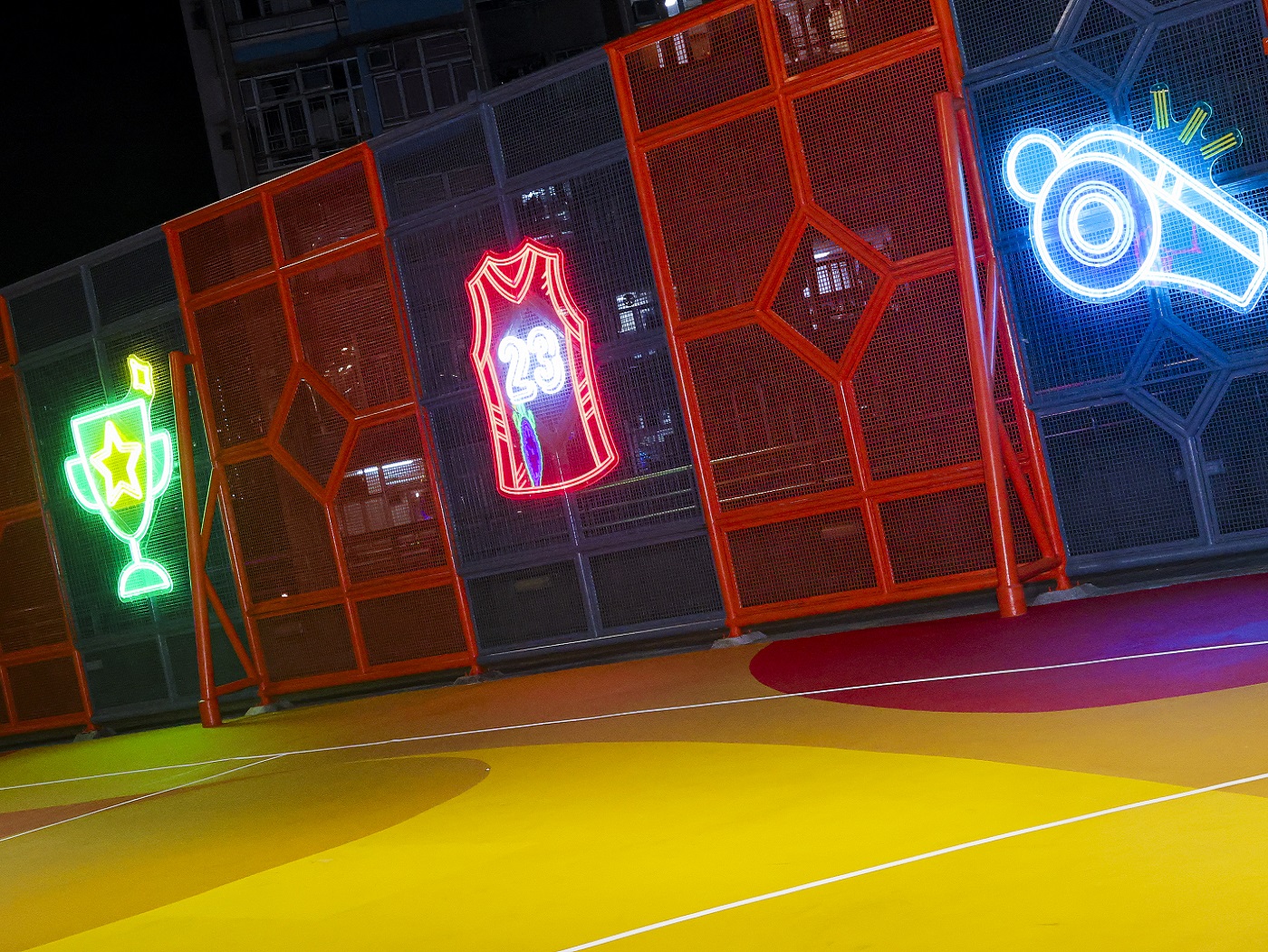 By night, the basketball-themed photo wall becomes a fun, social spot that adds new energy to the community’s daily life.